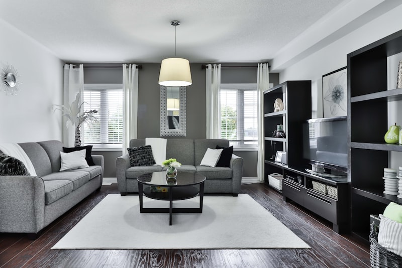 A sunlit living room blending natural wood, soft textiles, and a few carefully chosen decorative objects