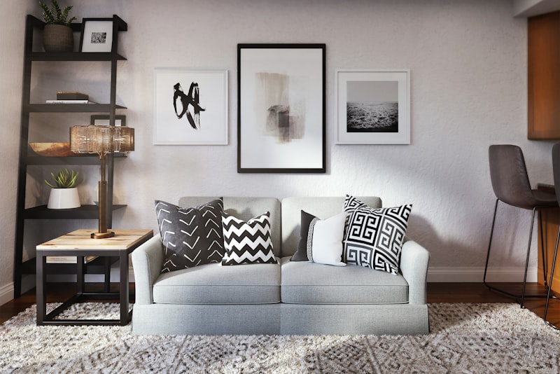 An elegant, neutral living room that looks high-end through styling, lighting, and tidy edited surfaces.